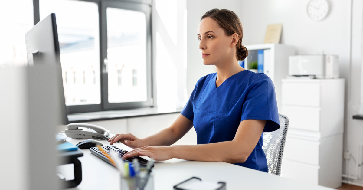 Doctor works on the computer
